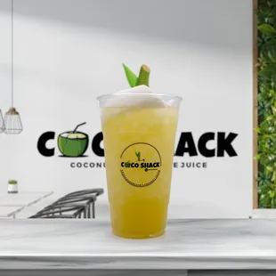 a drink in a plastic cup on a counter