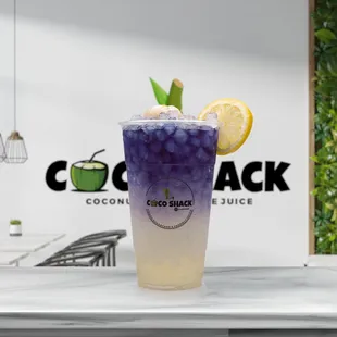 a cold drink with a lemon wedge