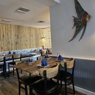 a dining area with tables and chairs