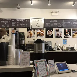 a coffee shop with menus on the wall