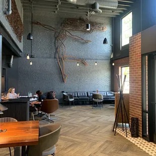 a restaurant with a wood table and chairs