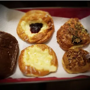 Chocolate Cream filled bar, Cheese Danish, Feta and Spinach roll, and Maple Bacon w/ syrup infusion donut.  Yummy!!