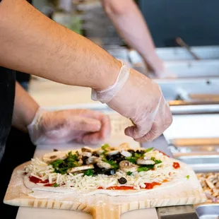 a person making a pizza