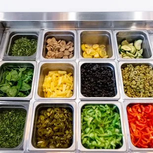 a variety of vegetables in trays