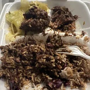 I only got two little oxtails (top left) and the rest were bones (top right). Rice was soaked with the oil gravy. Just nasty.