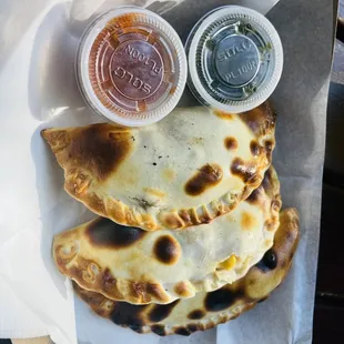 a plate of quesadillas and condiments