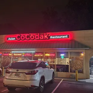 a car parked in front of the restaurant