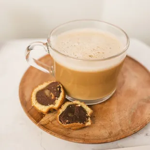 a cup of coffee and cookies