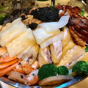 a plate of seafood and broccoli