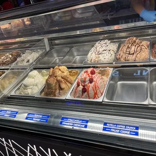 a variety of ice creams in a display case