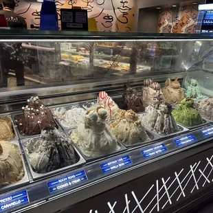 a variety of ice creams in a display case