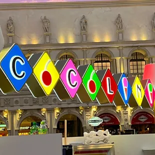 a colorful sign in front of a building