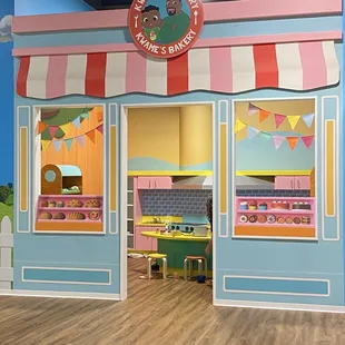 Kwame's Bakery has a full kitchen with food supplies that your child can play with.