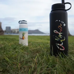 UV-printed flasks, featuring designs by local Hawaii artists.
