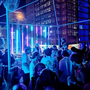 a crowd of people dancing at a party