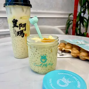 two cups of milk and a bagel