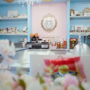 a pink and blue room with a chandelier