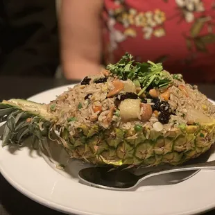 a pineapple with rice and vegetables