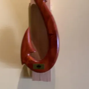 a wooden hook on a wall