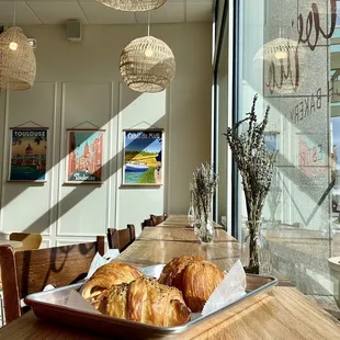 a tray of croissants on a table