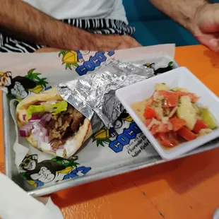 Gyro with tomato and cucumber salad