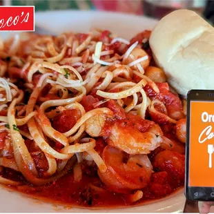 Seafood Arrabiata - 
Succulent shrimp and scallops in a spicy red 
sauce served over linguini.