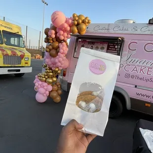 Coco Lip Smacking cupcakes  s&apos;mores cookies   Plan  your moments balloon garland attached to the truck