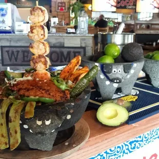 MOLCAJETE! STEAK, CHICKEN, SHRIMP, CHORIZO MARINATED IN OUR SPECIALS SEASONING, WITH COOKED CACTUS AND FRESH VEGGIES