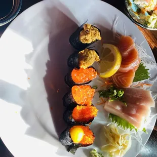 Uni , Ikura, masago nigiri, hamachi, sake sashimi