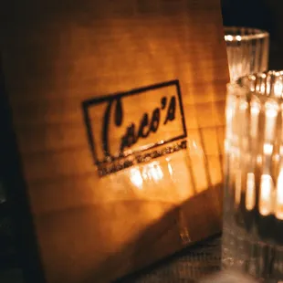 a wooden box with the name of the restaurant