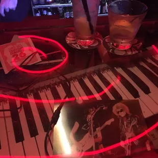 Bar top. Cool music memorabilia under the glass.