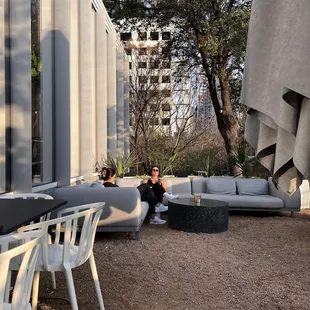 two people sitting on a patio