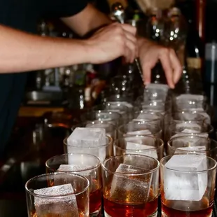 a bartender pouring a drink