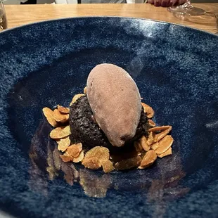 Gluten free, dairy free chocolate cake and ice cream with orange candied almonds