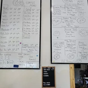 a woman sitting in front of a whiteboard