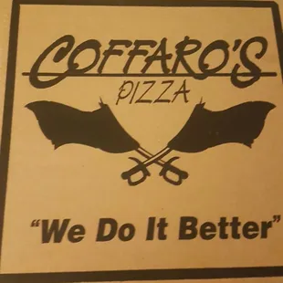 a person standing in front of a pizza box