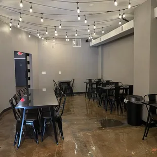 a restaurant with tables and chairs