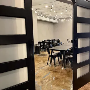 a conference room with tables and chairs