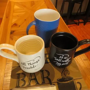 two coffee mugs on a table