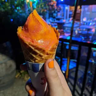 Sorbet in a waffle cone (in the process of being eaten)