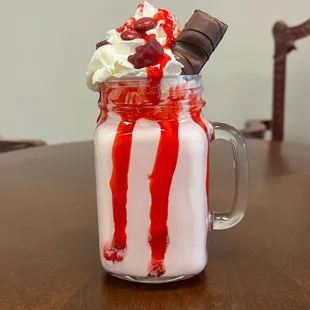 a milkshake with whipped cream and chocolate