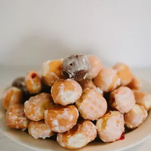 a pile of donuts on a plate