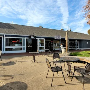 Outside seating. Next door to a nail salon.