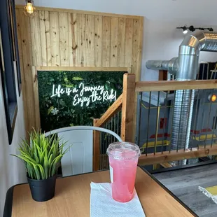 Top area seating with a strawberry railway drink.