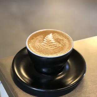 a cup of coffee on a saucer