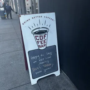 a sign on the sidewalk