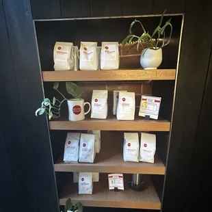 a shelf of coffee bags