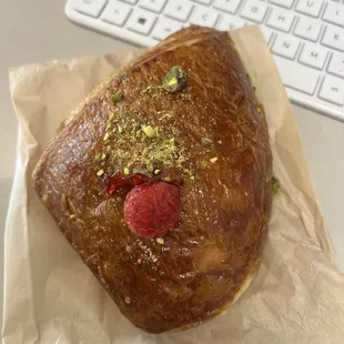 Raspberry pistachio croissant