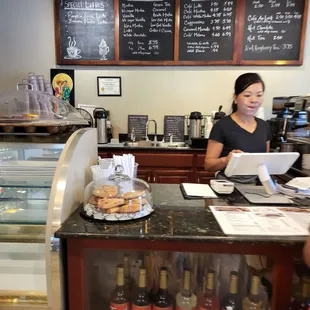 a woman working behind a counter