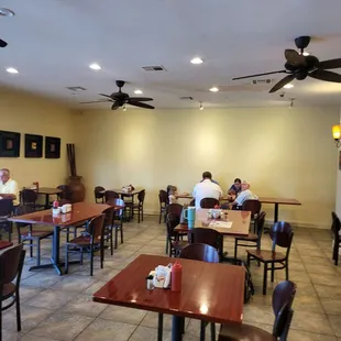 people sitting at tables and eating